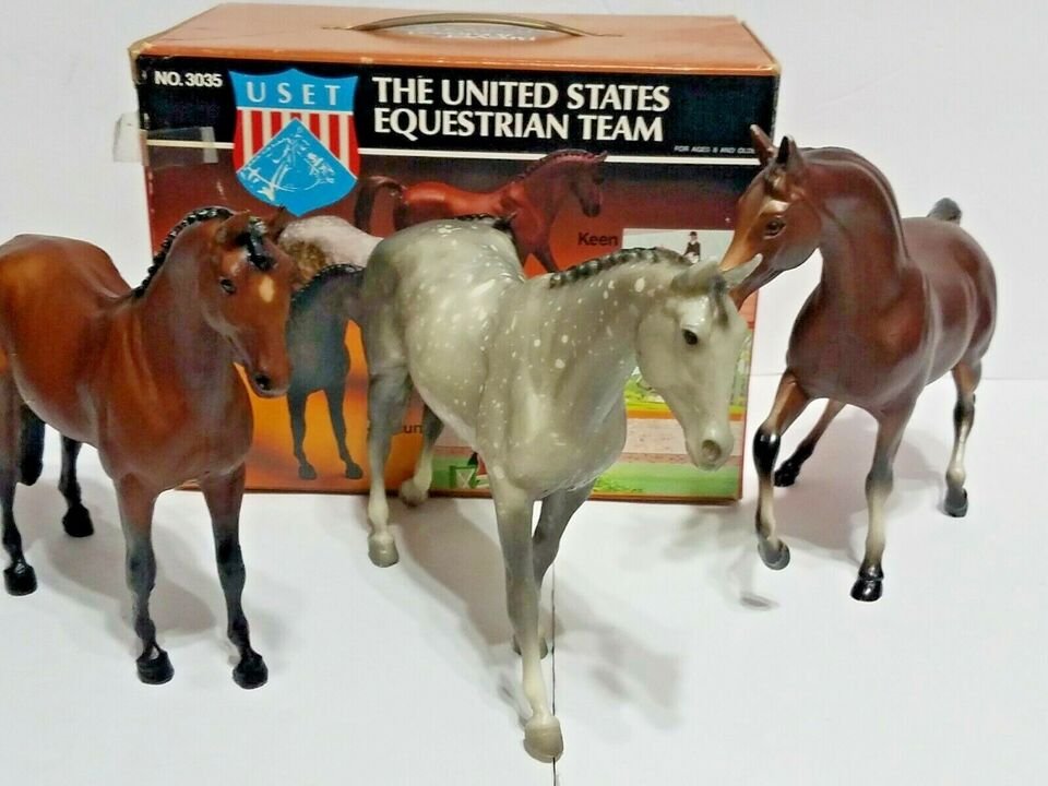 The original USET set featuring Keen, Jet Run, and Might Tango, a standing bay, a walking dapple gray, and a prancing-ish bay horse